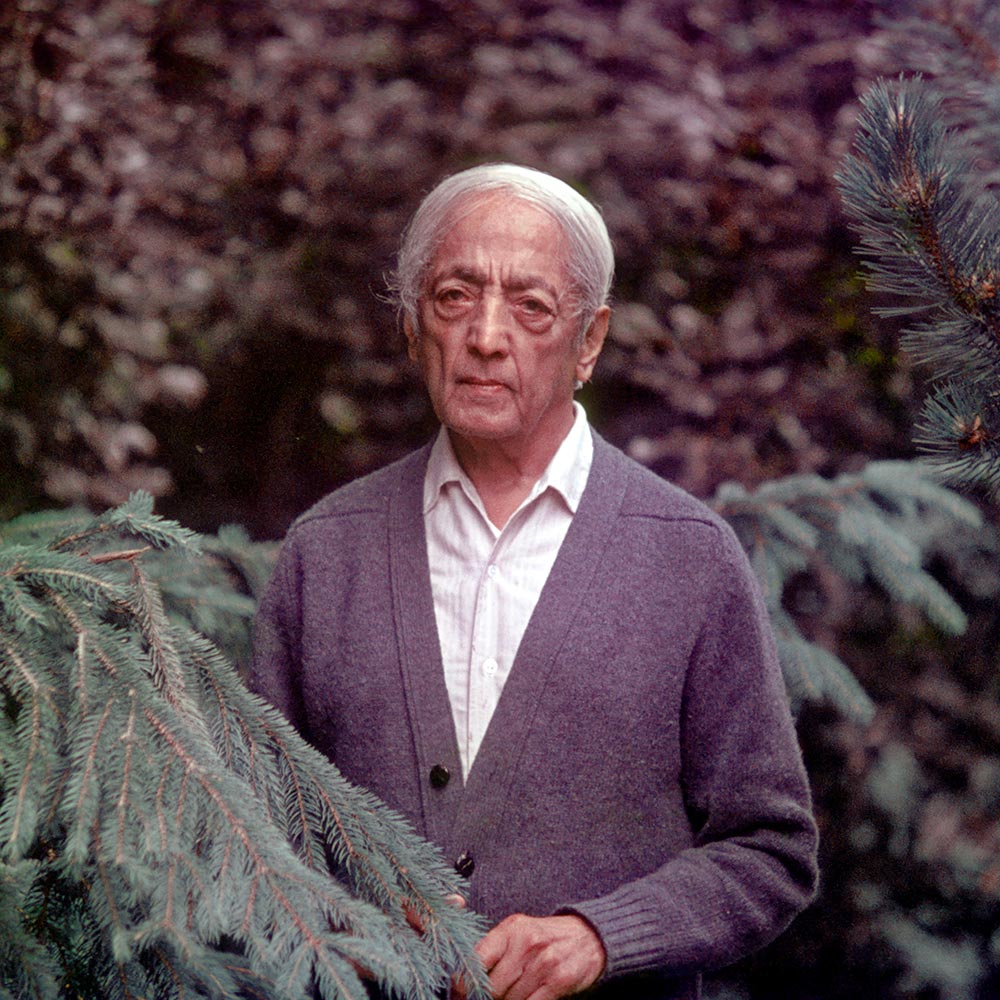 Krishnamurti near pine trees