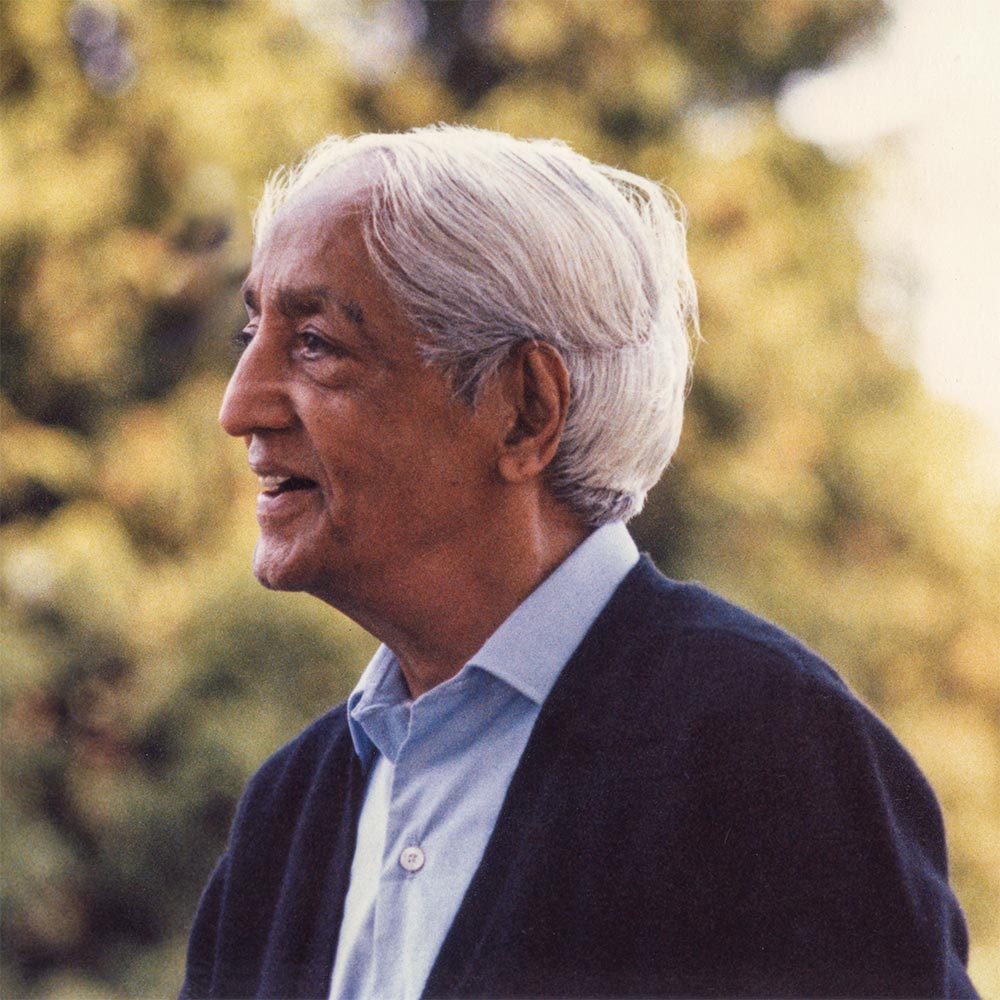 Krishnamurti outdoors smiling