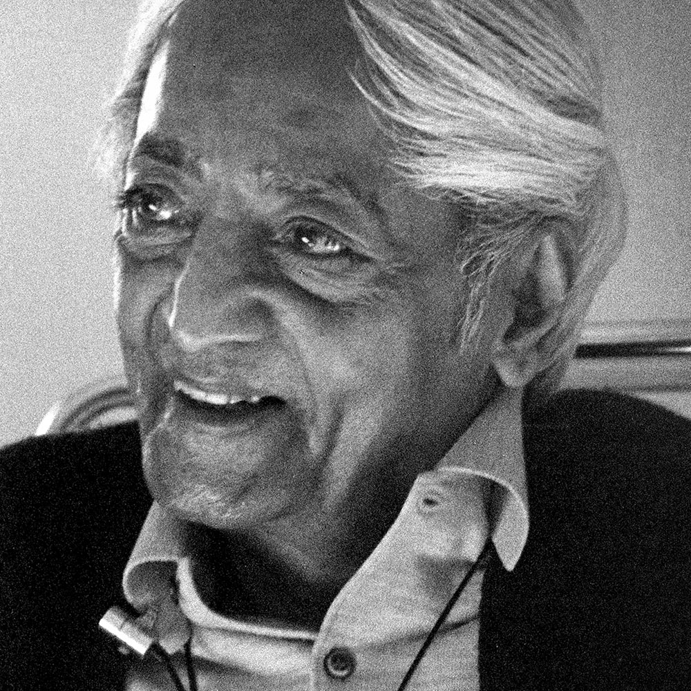 Krishnamurti smiling at the camera