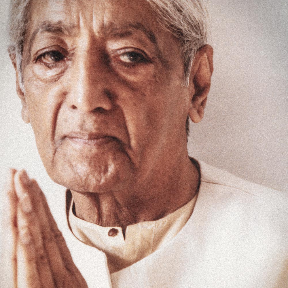 Krishnamurti smiling at the camera