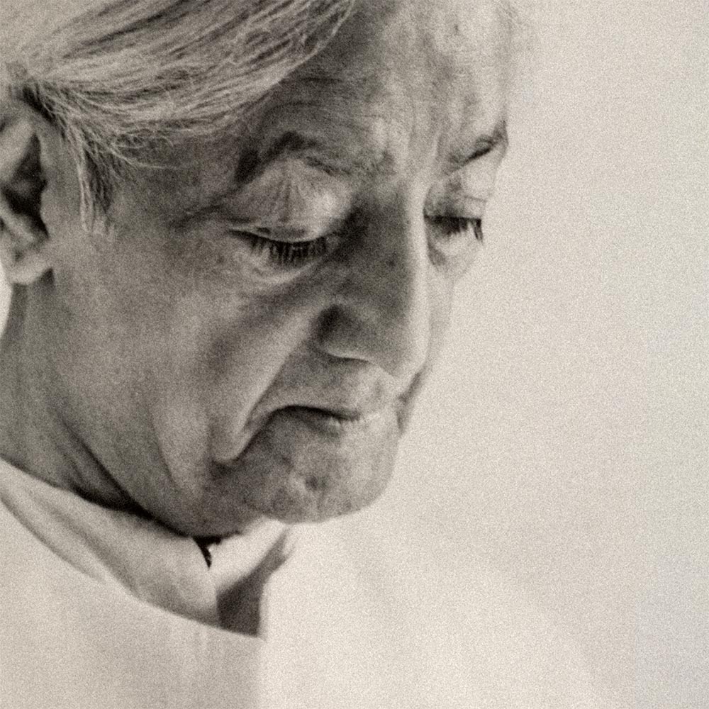 Krishnamurti smiling at the camera