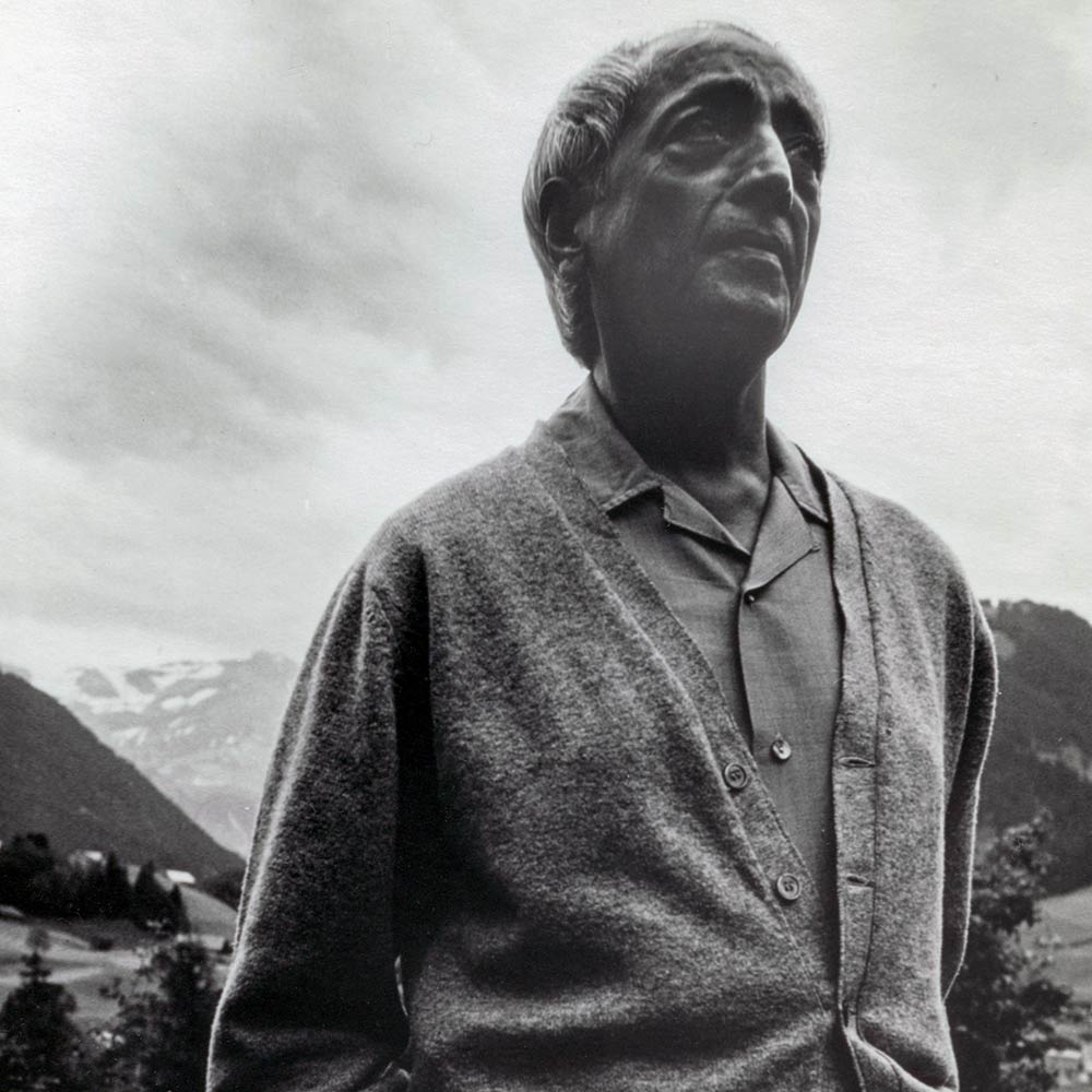 Krishnamurti smiling at the camera