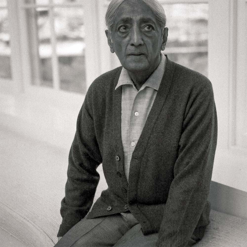 Krishnamurti smiling at the camera