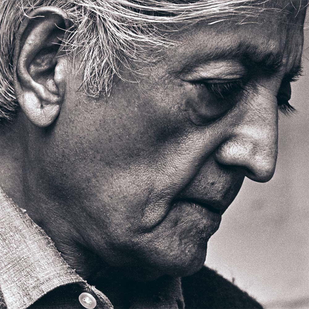 Krishnamurti smiling at the camera