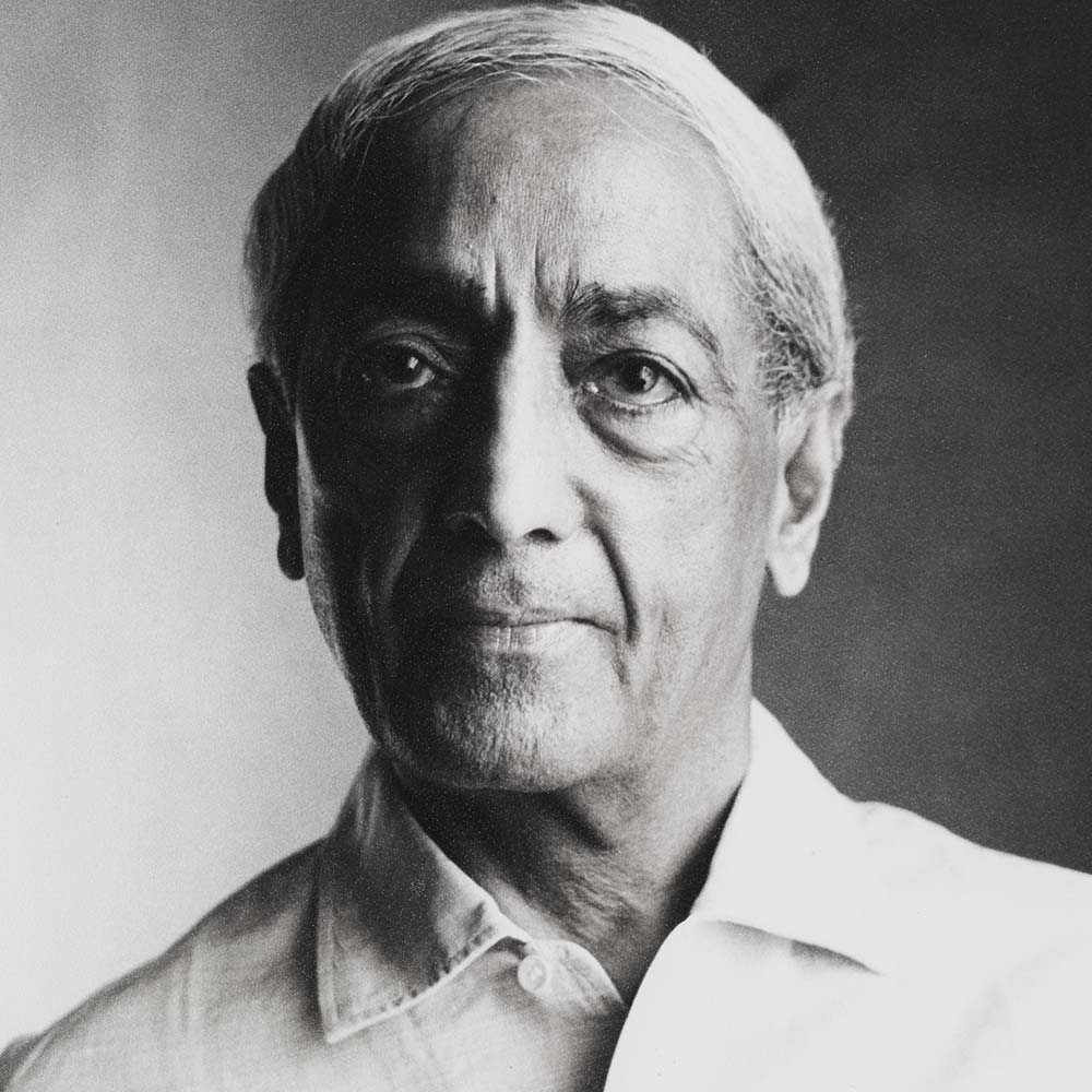 Krishnamurti smiling at the camera