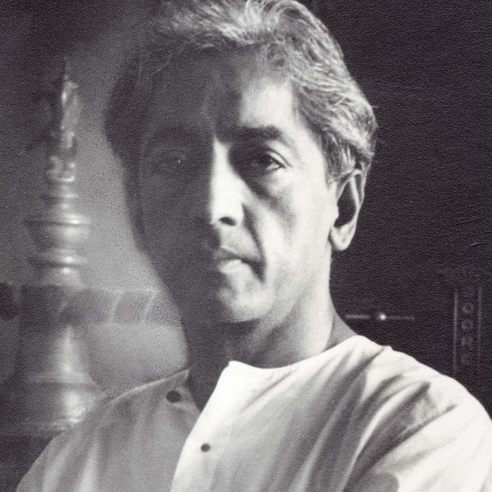 Krishnamurti smiling at the camera