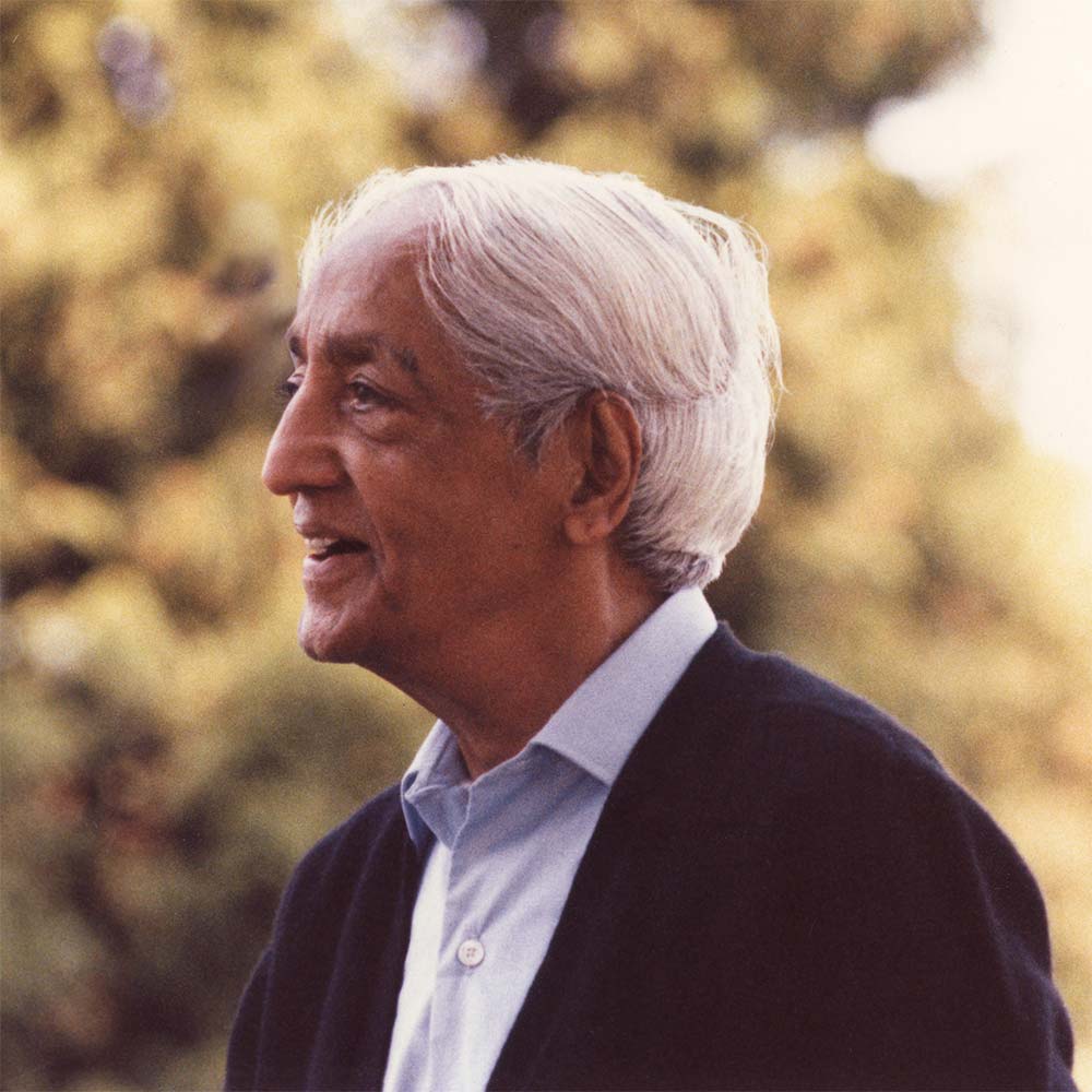 Krishnamurti smiling at the camera