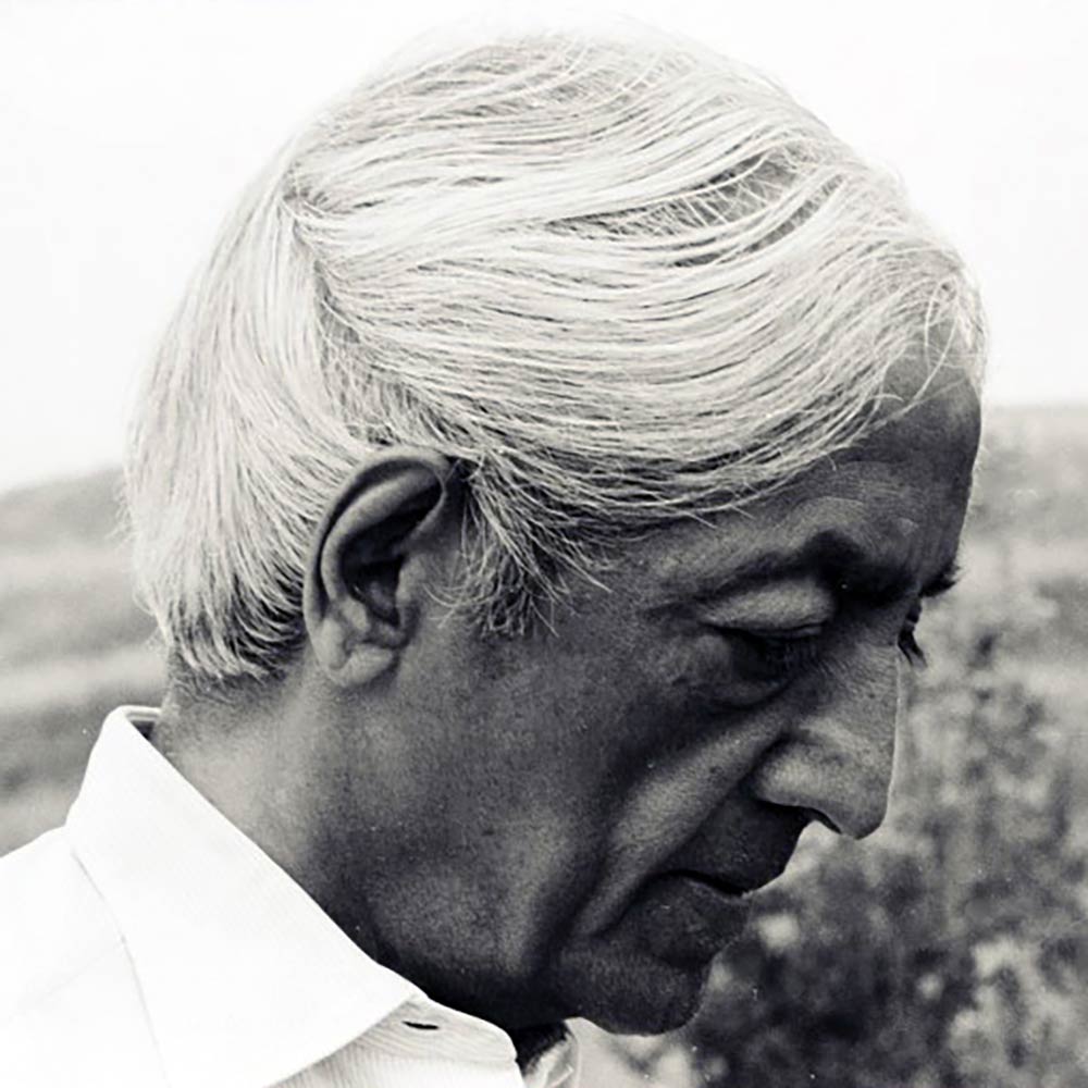 Krishnamurti smiling at the camera