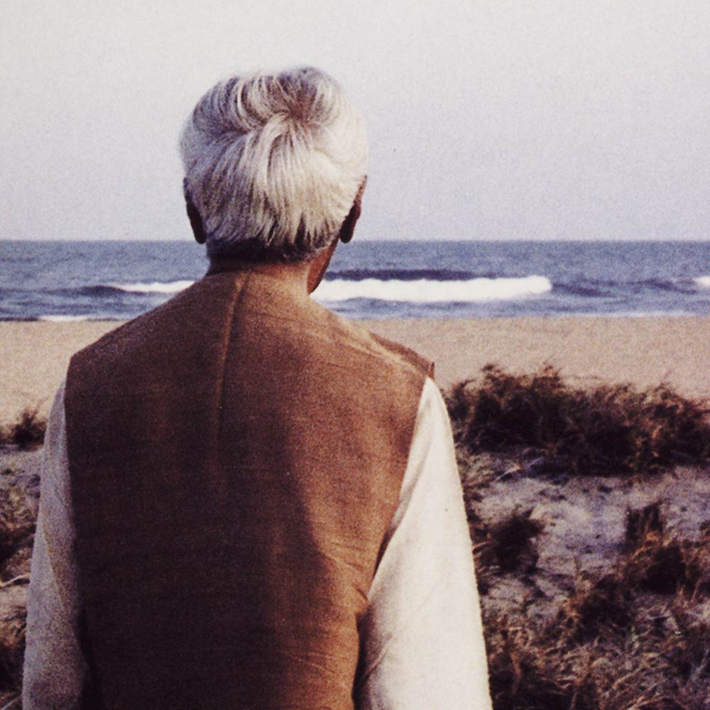 Krishnamurti smiling at the camera