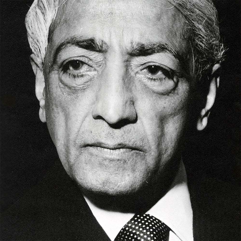 Krishnamurti smiling at the camera