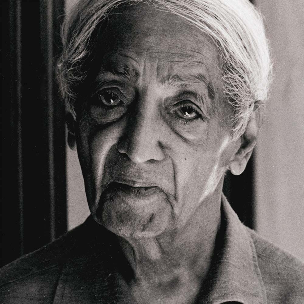 Krishnamurti smiling at the camera