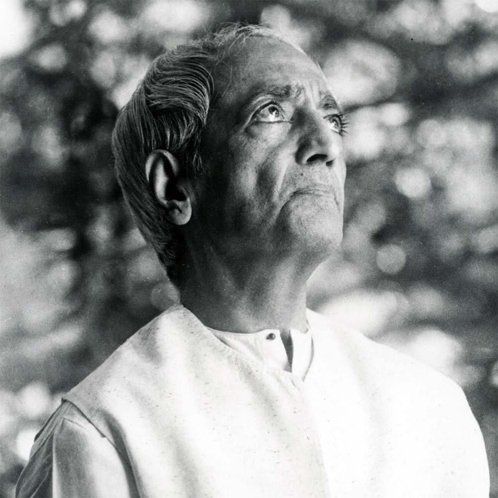 Krishnamurti smiling at the camera