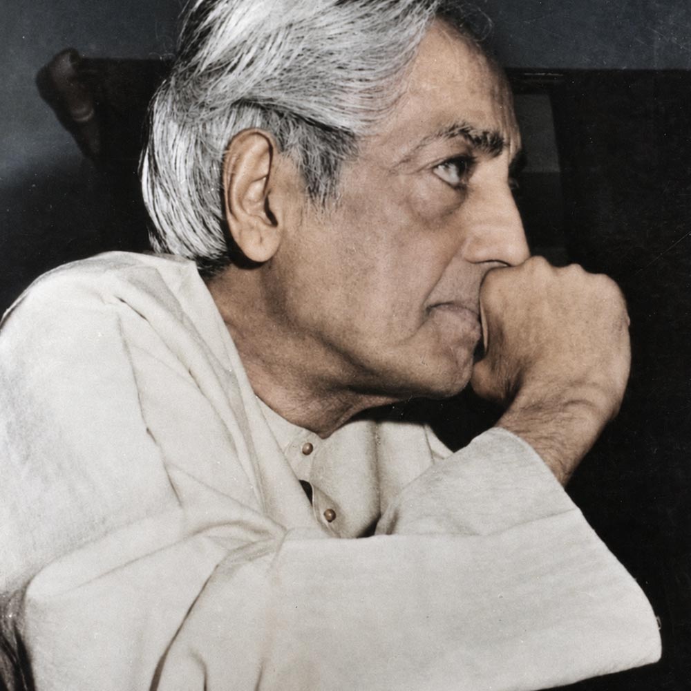 Krishnamurti smiling at the camera
