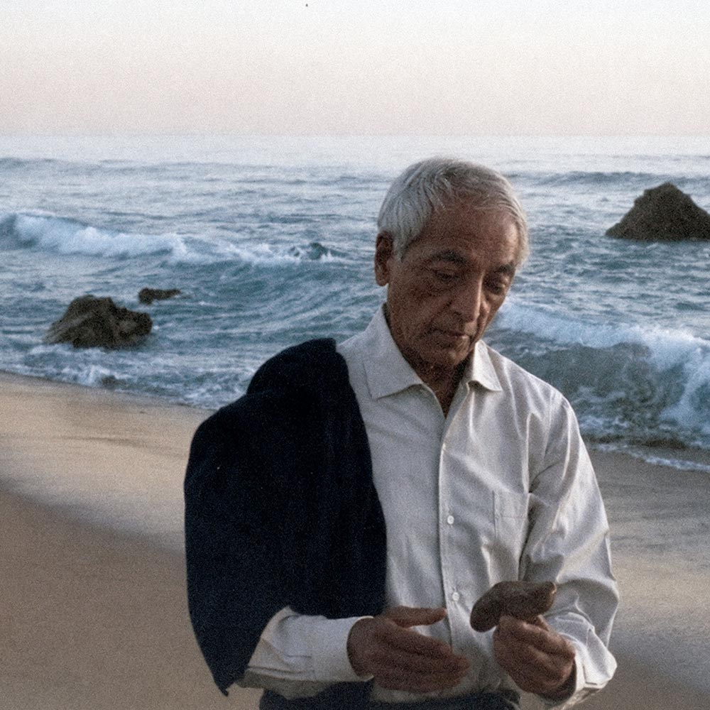 Krishnamurti smiling at the camera