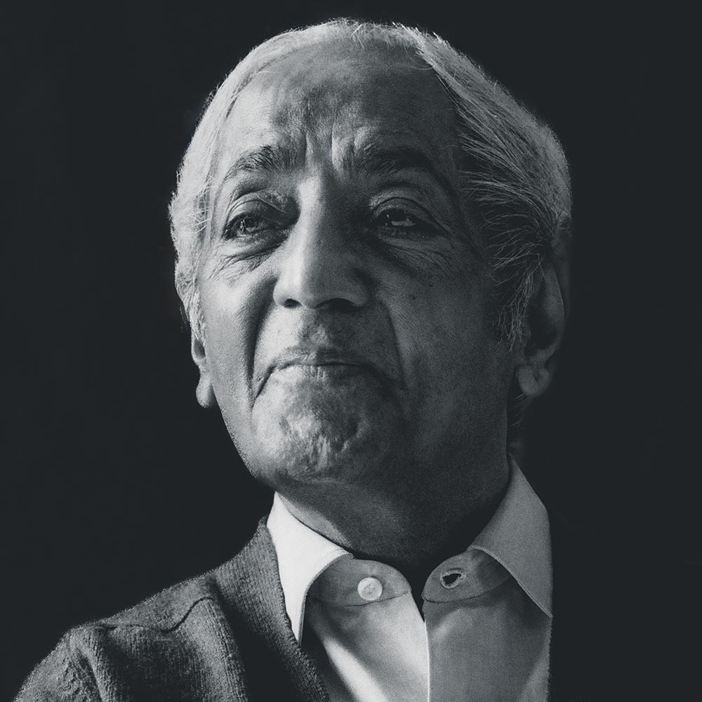 Krishnamurti smiling at the camera